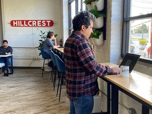 Two members meeting at a collaboration table discussing business