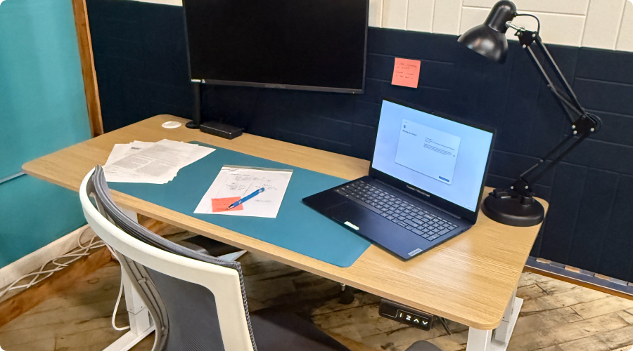 A computer at a station in Cowork + Connect