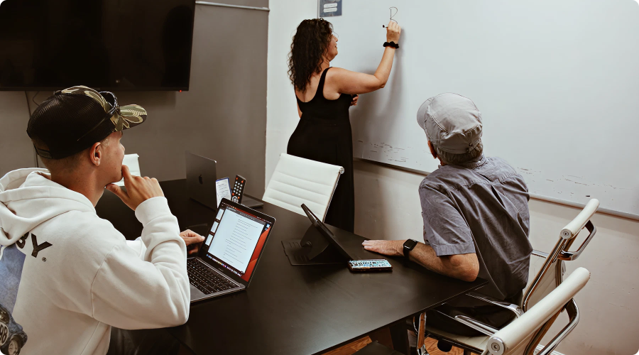 People collaborating in a Cowork + Connect conference room